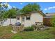 Exterior shot of shed with a weathered grill and some rock landscaping at 110 N Sunland Dr, Sanford, FL 32773