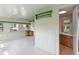 Versatile sunroom with bright interiors, tiled floor, and easy access to an adjacent bathroom at 110 N Sunland Dr, Sanford, FL 32773