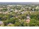 Aerial view showcasing the neighborhood, with mature trees, and the home's location at 1212 N Hudson St, Orlando, FL 32808