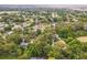 Aerial view showcasing the neighborhood, with mature trees, and the home's location at 1212 N Hudson St, Orlando, FL 32808