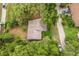 Aerial view of the house with mature trees and landscaping on a private lot at 1212 N Hudson St, Orlando, FL 32808