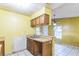 Kitchen featuring wooden cabinets, and a tile backsplash at 1212 N Hudson St, Orlando, FL 32808