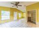 View of the living room showcasing the open layout, tiled flooring, and a decorative front door at 1212 N Hudson St, Orlando, FL 32808