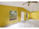This living room offers natural light, decorative windows, and an open floor plan at 1212 N Hudson St, Orlando, FL 32808