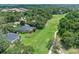 A high angle shot of a home beside a pristine green golf course at 1224 Northern Way, Winter Springs, FL 32708