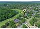 Expansive aerial view highlighting a lush residential area bordering a meticulously maintained golf course at 1224 Northern Way, Winter Springs, FL 32708