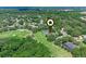 Aerial shot showcasing a residential area adjacent to a lush, green golf course at 1224 Northern Way, Winter Springs, FL 32708