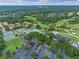 Wide aerial shot captures homes, a golf course, a pool, and tennis courts at 1224 Northern Way, Winter Springs, FL 32708