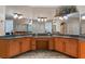 Spacious bathroom featuring dual sinks, granite countertops, and large mirrors for a luxurious experience at 1224 Northern Way, Winter Springs, FL 32708