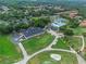 Aerial shot of a country club with a clubhouse, golf course, and parking at 1224 Northern Way, Winter Springs, FL 32708