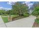 Long driveway leading to the property, surrounded by beautiful trees at 1224 Northern Way, Winter Springs, FL 32708