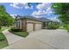 Spacious three-car garage and expansive driveway at 1224 Northern Way, Winter Springs, FL 32708