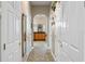 Hallway view leading to the bathroom featuring arched openings, neutral decor, and tiled flooring at 1224 Northern Way, Winter Springs, FL 32708