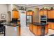 Modern kitchen with stainless steel appliances, a center island, and ample cabinet space at 1224 Northern Way, Winter Springs, FL 32708