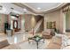 Open living area with staircase, stylish decor, and plenty of natural light at 1224 Northern Way, Winter Springs, FL 32708