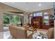 Bright living room with large windows, comfortable seating, and a seamless connection to the outdoor patio at 1224 Northern Way, Winter Springs, FL 32708