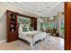 Serene main bedroom with large windows, a decorative ceiling fan, and a cozy sitting area at 1224 Northern Way, Winter Springs, FL 32708