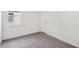 This bedroom has a neutral color palette, carpeting, and a window for natural light at 1323 Wood Line Dr, Deland, FL 32720