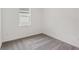 Bright bedroom with neutral walls, a window, and cozy carpeting, perfect for relaxation at 1323 Wood Line Dr, Deland, FL 32720