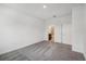 Minimalist bedroom featuring carpeted floors, neutral paint, and access to an ensuite bathroom at 1323 Wood Line Dr, Deland, FL 32720