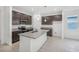 Beautiful kitchen featuring granite countertops, stainless steel appliances, and dark wood cabinets at 1323 Wood Line Dr, Deland, FL 32720