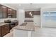 Modern kitchen features granite countertops, stainless steel appliances, and stylish pendant lights at 1323 Wood Line Dr, Deland, FL 32720