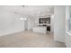 Open kitchen with a center island, dark cabinets, stainless appliances, and tile flooring at 1323 Wood Line Dr, Deland, FL 32720