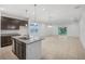 Open concept kitchen with granite countertops, stainless steel appliances, and an island at 1323 Wood Line Dr, Deland, FL 32720