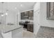 Charming kitchen with granite countertops, stainless steel appliances, and stylish pendant lighting at 1323 Wood Line Dr, Deland, FL 32720