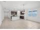 Spacious living area featuring an open layout, neutral tile flooring, and natural light at 1323 Wood Line Dr, Deland, FL 32720