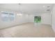 Bright, airy living space with tile floors and sliding glass doors leading to the outdoors at 1323 Wood Line Dr, Deland, FL 32720