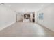Open living room showcases tiled floors and an eat-in kitchen with granite countertops at 1323 Wood Line Dr, Deland, FL 32720
