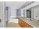 This bathroom has dual sinks, a separate shower stall, and a large soaking tub at 1406 Kissimmee Ct, Kissimmee, FL 34759