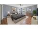 Relaxing bedroom with a comfortable king-size bed, decorative artwork, and soft lighting at 1406 Kissimmee Ct, Kissimmee, FL 34759