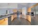 Modern kitchen featuring stainless steel appliances, granite countertops, and stylish backsplash at 1406 Kissimmee Ct, Kissimmee, FL 34759