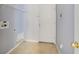 This is a simple laundry room with tile floors and access to the outside at 1406 Kissimmee Ct, Kissimmee, FL 34759