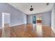 This spacious living room has hardwood floors and sliding glass doors to the patio at 1406 Kissimmee Ct, Kissimmee, FL 34759