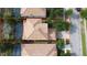 Overhead view of a property with a tile roof, a driveway, and a well-manicured lawn at 1452 Moon Valley Dr, Davenport, FL 33896