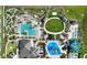 Aerial view of the community pool, splash pad, mini golf, playground and surrounding area at 1452 Moon Valley Dr, Davenport, FL 33896