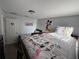 This bedroom features bunk beds, Disney-themed wall decorations and cartoon bedding at 1452 Moon Valley Dr, Davenport, FL 33896