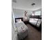 This bedroom includes one twin bed, one bunk bed and a Mickey Mouse wall decoration at 1452 Moon Valley Dr, Davenport, FL 33896