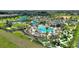 Resort-style pool with water slides, mini golf, cabanas and lush landscaping, providing an oasis for relaxation and recreation at 1452 Moon Valley Dr, Davenport, FL 33896