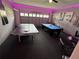Fun game room with ping pong table, pool table, foosball, and quirky decorations at 1452 Moon Valley Dr, Davenport, FL 33896