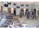 Bright gym with treadmills, weights, and tv's for an ultimate workout experience at 1452 Moon Valley Dr, Davenport, FL 33896