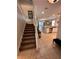Interior view showcases the open staircase and seamlessly connected living spaces perfect for entertaining guests at 1452 Moon Valley Dr, Davenport, FL 33896