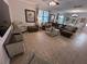 Comfortable living room featuring a large sectional sofa and neutral colors at 1452 Moon Valley Dr, Davenport, FL 33896