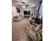 Upstairs living room offering dual couches, plush seating, and media center at 1452 Moon Valley Dr, Davenport, FL 33896