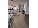 Open-concept living space featuring tile flooring and seamless flow between kitchen and dining area at 1452 Moon Valley Dr, Davenport, FL 33896