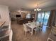 A welcoming living space with ample seating and pool access, perfect for relaxation and entertainment at 1452 Moon Valley Dr, Davenport, FL 33896
