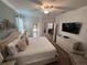 Spacious main bedroom showcasing a king-size bed, tasteful decor, and ample closet space at 1452 Moon Valley Dr, Davenport, FL 33896